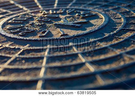 Close-up Of The Metal Manhole Cover