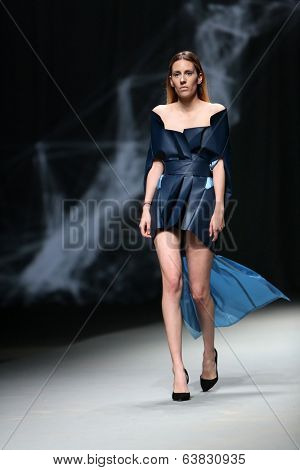 ZAGREB, CROATIA - APRIL 10 : Fashion model wears clothes made by Petra Vuletic and Sasa Hortig on 