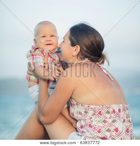 Baby and mother outdoor portrait