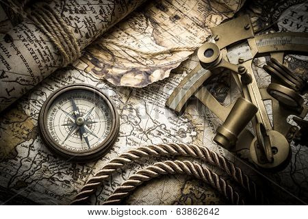 vintage still life with compass,sextant and old map