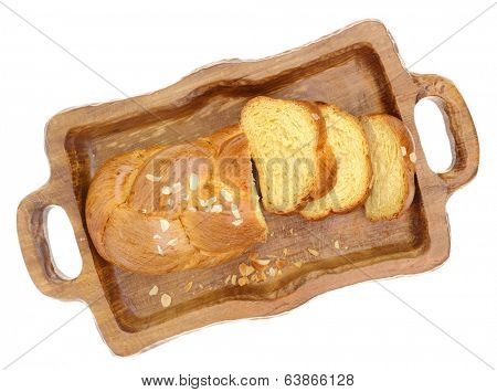 Sweet braided brioche bread on tray isolated on white 