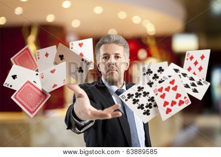 Bluff, Handsome man playing with poker cards