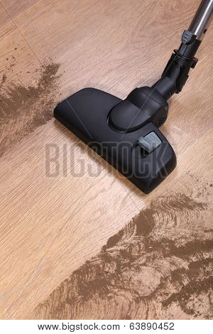 Vacuuming floor in house
