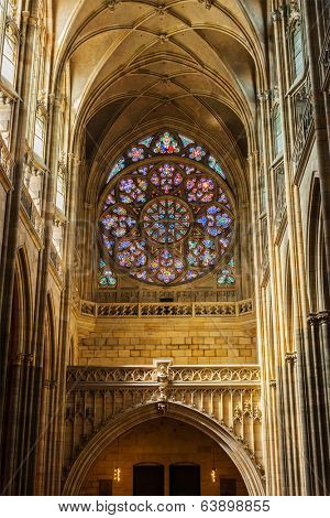 PRAGUE, CZECH REPUBLIC - APRIL 27, 2012: Interior of St. Vitus cathedral with rose window above the cathedral's main entrance designed by Frantisek Kysela, Prague, Czech republic