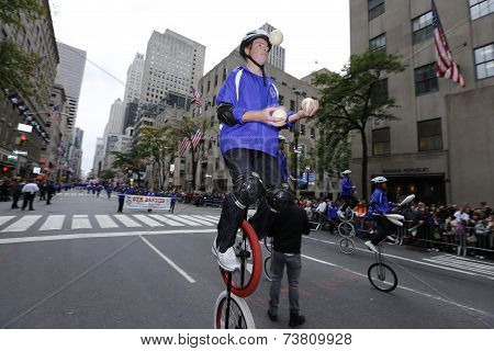 Gym Dandies juggle in unicycles