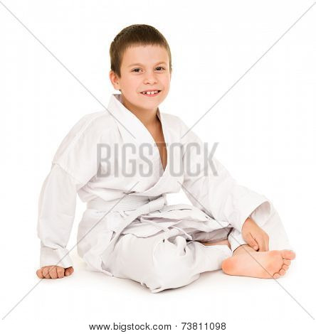 boy in white kimono for martial arts posing