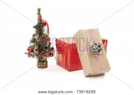 Christmas gifts and a small decorative christmas tree.