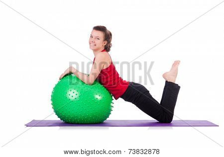 Young woman exercising with swiss ball
