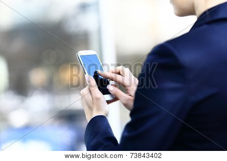 Close up of a woman using mobile smart phone