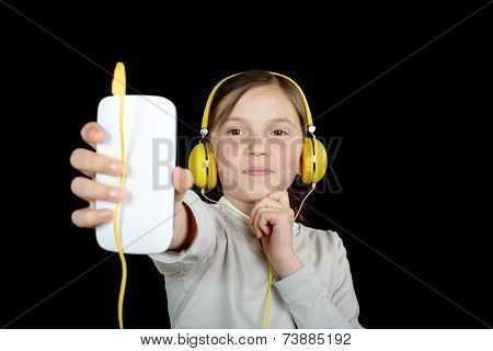 A Beautiful Young Girl Listening To Music With A Walkman