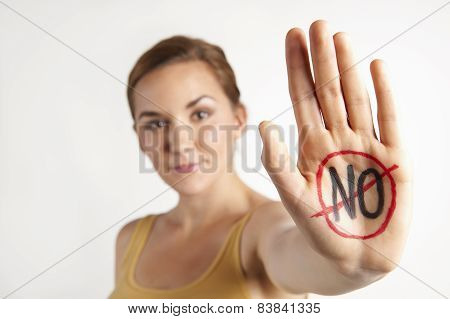 Female Protestor With "no" Written On Palm