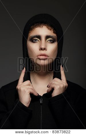Trendy Young Woman In Hood Over Black Background