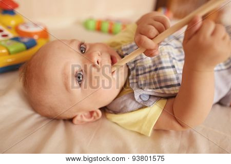 Small Kid Playing With Drum Stick