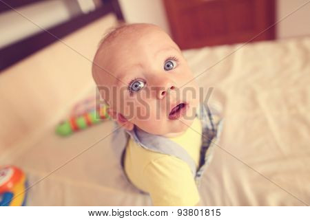 Playful Kid In His Bed