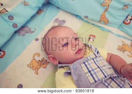Playful Kid In His Bed