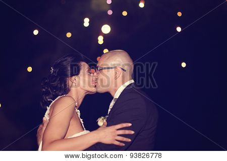 Bride And Groom Surrounded By Fire Crackers
