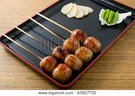 Thai Grilled Sausages On A Black Tray