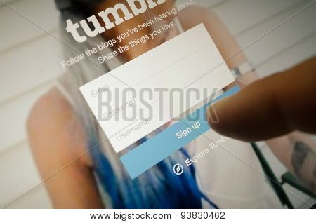 Tumblr Page With Finger Touch On Sign Up Button In Register Page