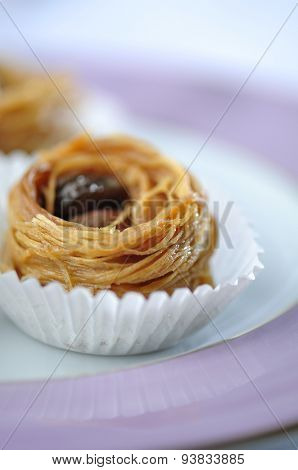 Bird's nest - a mediterranean sweet presented in a paper cups. Tight closeup shot.