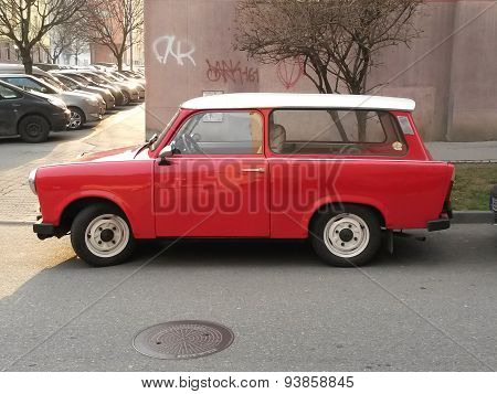PRAGUE CZECH REPUBLIC - CIRCA MARCH 2015: Red Trabant car parked in a street of the city centre.