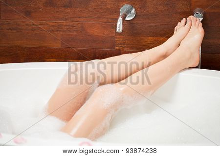 Legs Of Young Woman In Bathtub