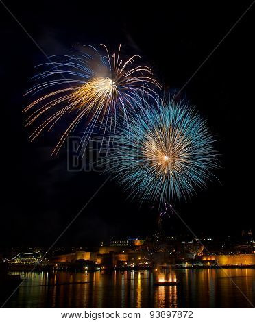 Colorful fireworks explode in Malta in dark sky,Malta fireworks festival,4 July Independence