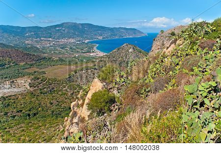The rocky of Tindari Mount with the view on coastal area covered with gardens Sicily Italy.