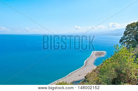 The beautiful seascape with the sandspit that is the part of Laghetti di Marinello Nature Reserve Tindari Sicily Italy.