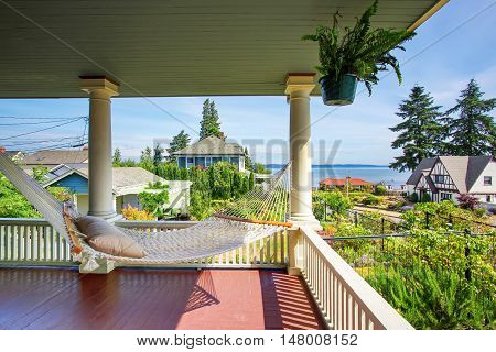 Hammock At The Wooden Walkout Porch Of Craftsman American House