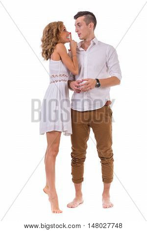 Happy young couple. Portrait of cheerful couple smiling against isolated white background in full length with copyspace