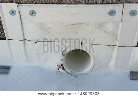 hole for evacuation of rainwater from a balcony waterproofed with PVC sheet