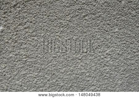 Grey cement plaster on the wall texture