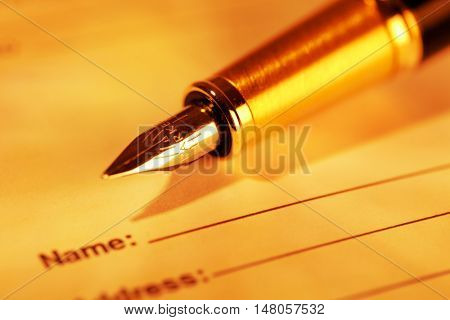 Parker Fountain Pen Lying on the Sheet of Paper with Name and Address - Close Up