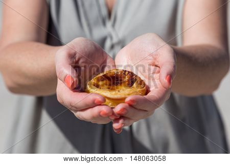 Portuguese Dessert Pasteis De Nata In Women Hand