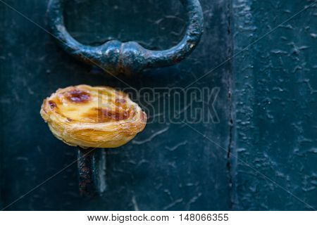 Portuguese Dessert Pasteis De Nata On Old Door
