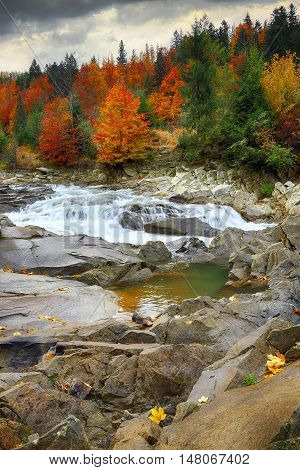 View of mountain river at autumn time. Nasty weather