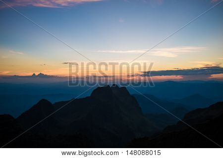 Mountain Silhoette Of Sub Alpine At Sunrise Glowing Sky