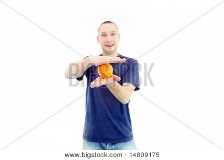 man holding orange in hand