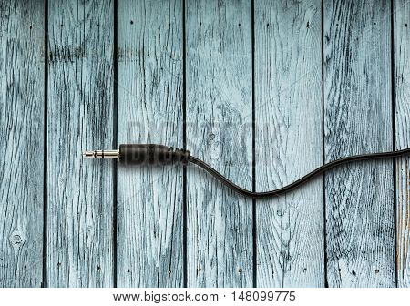 Jackplug On The Wooden Background