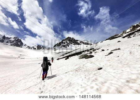 Two hikers in snow plateau. Turkey Kachkar Mountains highest part of Pontic Mountains. Wide angle view.