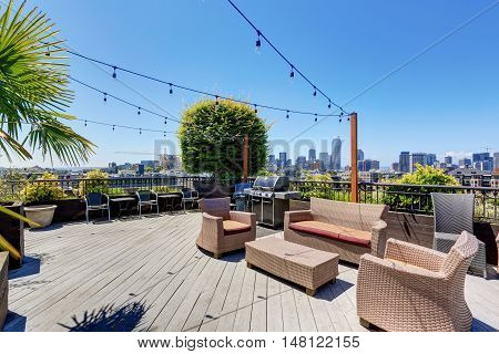 Walkout Deck Of Apartment Building With Many Armchairs