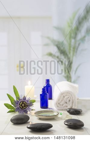Aromatherapy candles burning and bath towels for a relaxation