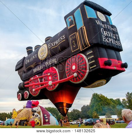 Ferrara Italy 16 September 2016 - A Special Shapes hot air baloon inspired by the famous Orient Express train at the Ferrara Balloons Festival