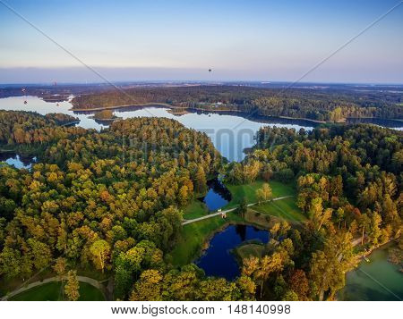 Aerial UAV top view of lakes next to Trakai and Vilnius, Lithuania in the sunset of autumn