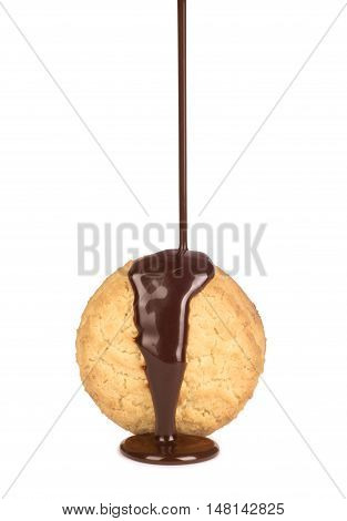 pouring chocolate on cookie isolated on white background