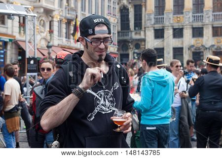 BELGIUM, BRUSSELS - SEPTEMBER 07, 2014: Belgian Beer Weekend 2014. The most famous beer festival in Belgium. Man at the festiwal.