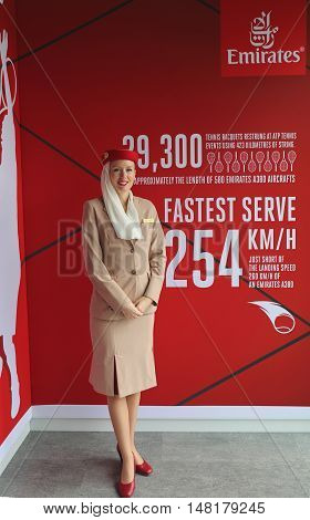 NEW YORK - SEPTEMBER 1, 2016: Emirates Airlines flight attendant at he Emirates Airlines booth at the Billie Jean King National Tennis Center during US Open 2016 in New York