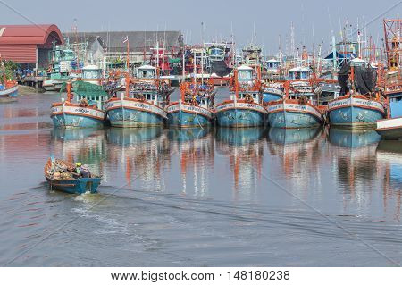 RAYONG THAILAND - APRIL 12 : local fishery boat approaching in rayong river port important sea food market place in eastern thailand on april 12 2016 in rayoung province thailand