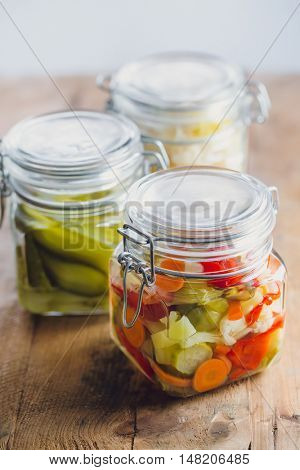 Pickled vegetables in glass jars