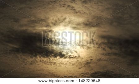 Strange Sun Behinde Dark Foggy Clouds